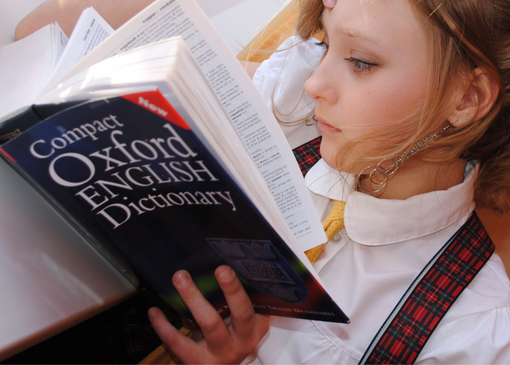 Girl reading dictionary